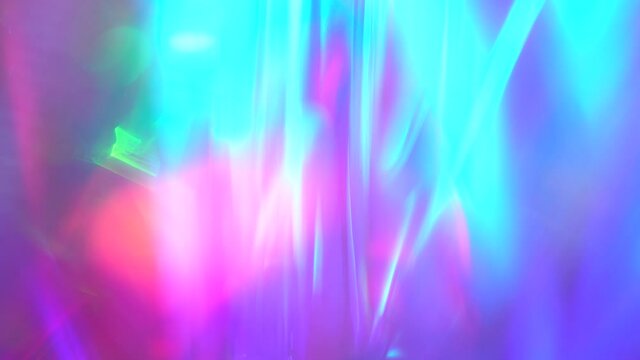 Rainbow light flares background or overlay. Bright retro neon purple teal blue and pink colors. Optical Crystal Prism Flare Beams. Abstract animation for light 