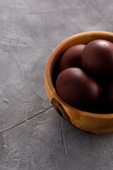 Still life many colorful easter eggs on a textural background. Rustic. Easter celebration concept.