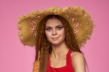 woman in straw hat coconut cocktail enjoyment exotic pink background
