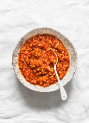 Delicious vegetarian cauliflower cabbage bolognese sauce on light background, top view. Healthy diet food concept