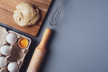 Flat Lay composition, ingredients for baking cookies on a gray background, copy space. Making cookies or cupcakes for Valentine's Day, Mother's Day, Father's Day. The concept of festive food