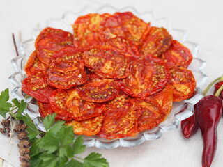 The concept of healthy eating,the benefits of dried fruits and vegetables. Dried tomato vegetable chips with ingredients for making sandwiches on a wooden table.