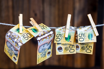 pinned banknotes on a clothes line. concept of money laundering