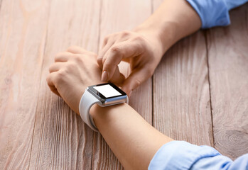 Young woman with modern smart watch, closeup