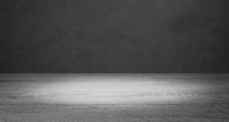 Empty wooden table on on dark loft wall background, using for studio background and product display concept