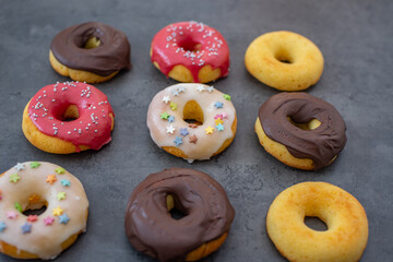 Donuts pattern. Top view of assorted glazed donuts.