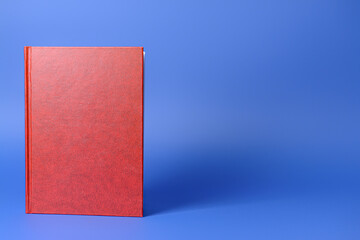 Blank book on color background