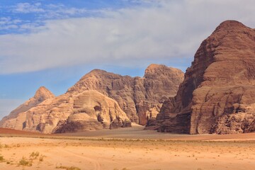 Fototapeta na wymiar beautiful relief red mountains with contrasting shadows in the Wadi Rum desert, Jordan nature