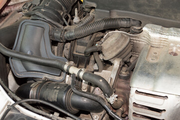 Air ducts and pipes under the hood of the car