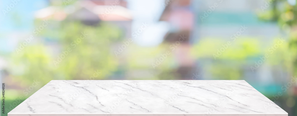 Poster spring background.Empty white marble table with blur tree in garden boekh background,banner mockup template for display of product