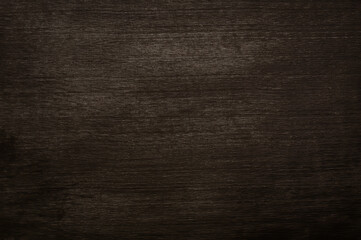 Abstract old black wooden board background with dark scratched and wood grain texture
