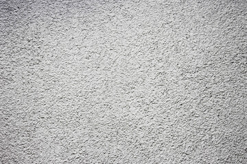 Stucco wall texture. White concrete surface background. Gray plaster wall pattern. Distressed noise backdrop for graphic design. Rough grain cement texture. Noise and grain overlay.
