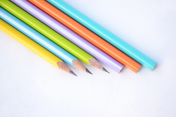 bunch the colorful wooden peels pencils isolated on white background.
