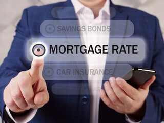  MORTGAGE RATE text in menu. Broker looking for something at cellphone. A mortgage rate is the rate of interest charged on a mortgage