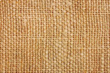 Brown fabric background. Warm color canvas texture. Bright textile material background. Closeup fiber pattern. Checkered textile texture.