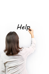 Woman writing the word Help on a white background. Assistance concept