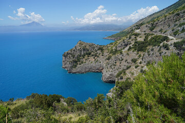 Fototapeta na wymiar Steep cliffs above blue calm sea, travel holiday concept, Campania, Italy