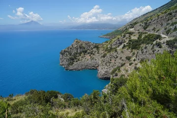 Fotobehang Steep cliffs above blue calm sea, travel holiday concept, Campania, Italy © Milan