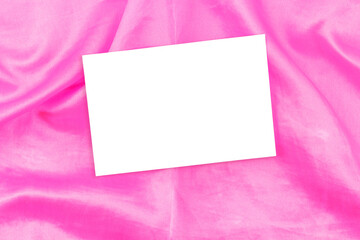 Mockup of white business cards on soft pink fabric, copy space