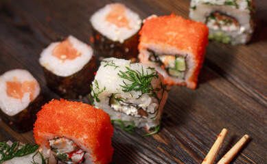 with sushi chopsticks ginger delicacy wooden background meal