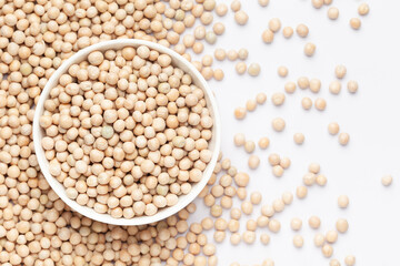Close up of Organic dry peas whole  (Pisum sativum) in a ceramic white bowl with the gradient background of matar dal. Top view 