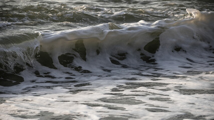 Sea wave close-up. Sea foam.