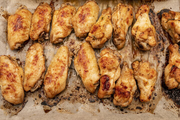Home roasted chicken wings on a baking tray.