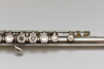 Fototapeta premium Silvery musical instrument with keys on a white background with soft shadow