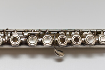 Fototapeta premium Silvery musical instrument with keys on a white background with soft shadow