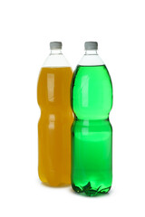 Plastic bottles with green and orange soda isolated on white background