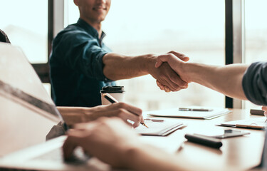 close up. young business people entering into a new contract.