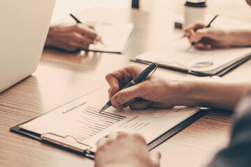 group of the employees analyzing financial charts