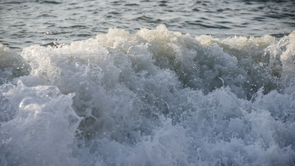 Sea wave close-up. Sea foam.