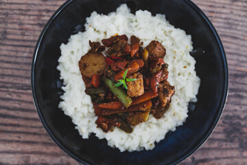 vegan thai stir fry with tofu and coconut milk rice, healthy plant-based food