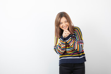 Portrait photo of a smiling cute woman model standing and posing