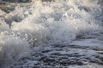 Sea wave close-up. Sea foam.