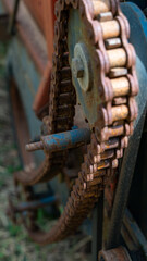 chain with rust from old vandalized agricultural machinery