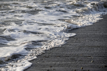 Sea wave close-up. Sea foam.