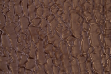 Macro photo of a sweet, delicious bar of chocolate photo taken from above