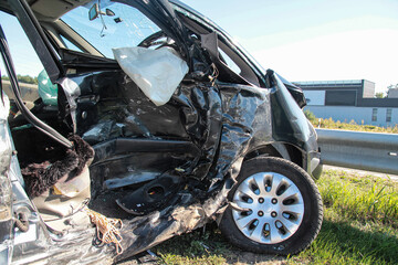 Auto accident. Crashed car in the street. Damaged car after collision