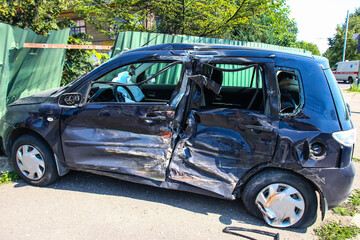Car accident in the street. Smashed auto after car collision