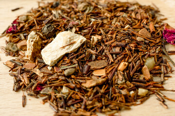 Dry rooibos healthy traditional organic tea with citrus and spices. Macro close-up. High quality photo