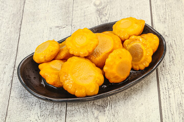 Marinated yellow patisson in the bowl