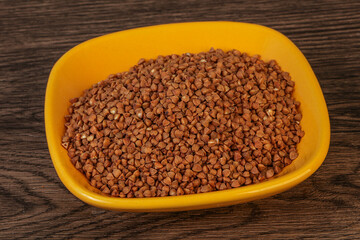 Raw buсkwheat cereal in the bowl