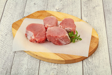 Raw pork medallion served rosemary