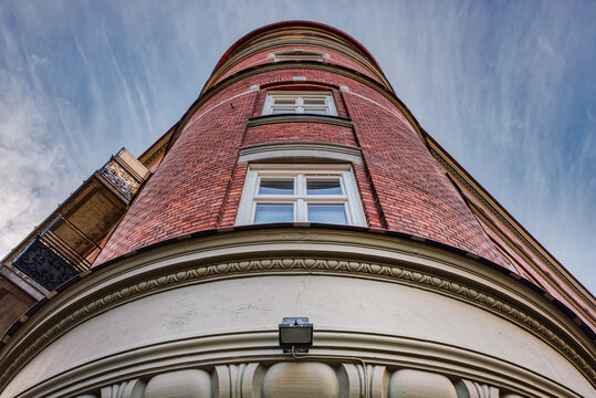 Cylindrical Classical Building Facade Made Of Bricks With Windows In The Middle. Neoclassical Or Rounded Building Features A Red Firebrick Exterior Makes A Neo Classical Architecture Representation