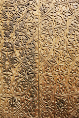 Antique door with wooden floral pattern