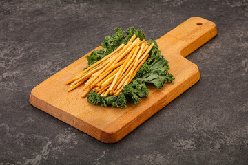 Chechel cheese sticks over board