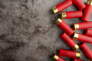 Red shotgun shell on texture background , Gun bullets can be used as a background