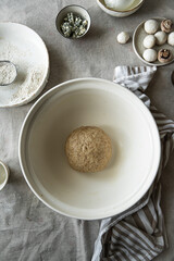 Step by step process of making wholegrain yeast dough for pizza. Kneaded dough before rising.